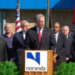 Nixon stood with Noranda officials twice in the last four years to announce major expansion packages. Now those are on hold.